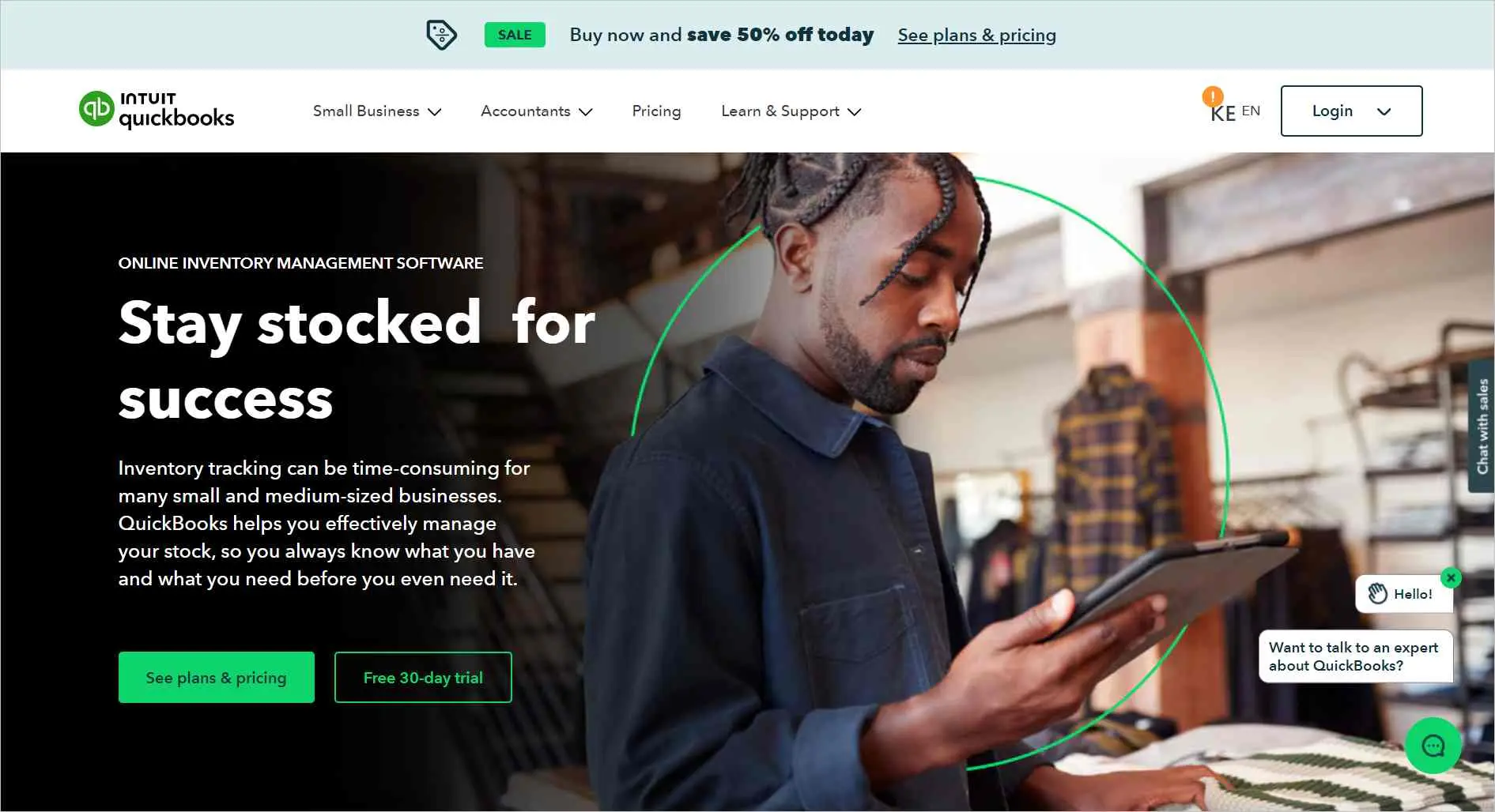 QuickBooks inventory management tools shown as a warehouse worker uses a tablet to stay stocked for success